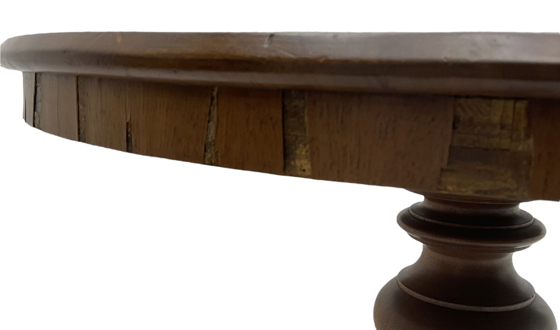 Victorian mahogany centre table, circular top on turned pedestal, on three flower head carved supports with scrolled terminals