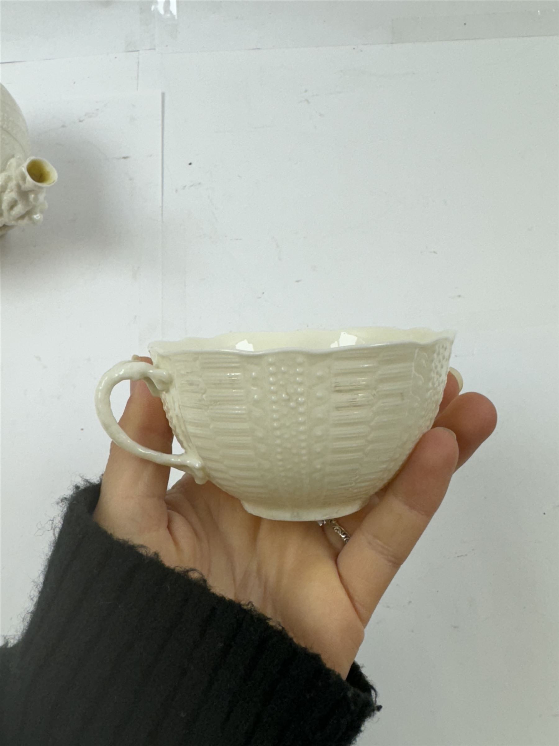 Belleek Sea Urchin teapot and sugar basin, together with Belleek Nautilus jug, small dish, teacup and saucer