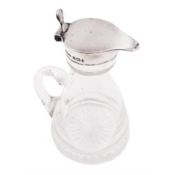 1930s silver mounted glass whiskey tot, with C handle and star cut base, the silver collar and cover with thumbpiece, hallmarked S Blanckensee & Son Ltd, Birmingham 1932, including thumbpiece H10.5cm