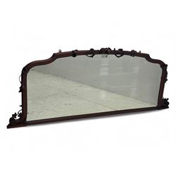 Late 19th century mahogany overmantel mirror, the carved frame decorated with carved fruit...