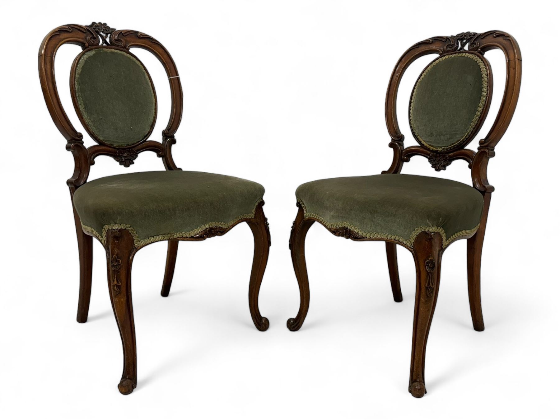 Pair of Victorian mahogany salon chairs, carved and pierced cameo back with scrolling acanthus leaf decoration and c-scrolls, upholstered in sage green fabric, on cabriole supports with floral mouldings