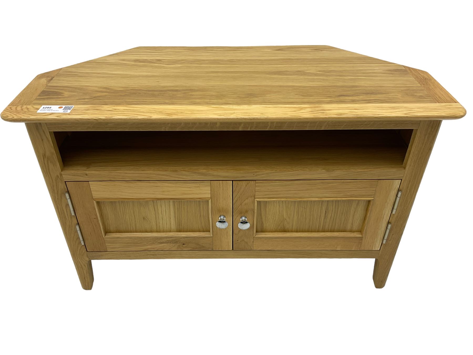 Contemporary light oak corner television stand, hexagonal top over recessed shelf, fitted with two panelled cupboard doors with chrome handles, on straight supports with rounded inner edges