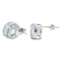 Pair of 9ct white gold round cut sky topaz stud earrings, hallmarked