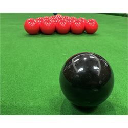 Riley - early 20th century full-sized mahogany billiards or snooker table, on eight turned baluster supports, with cue rack, scoreboard, balls and various cues 