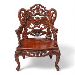 Pair of Japanese carved hardwood throne chairs, pierced and dragon carved cresting over pierced back panel carved with bat, extending dragon carved arms over panelled seat, the seat rails pierced and carved with trailing branches and foliate motifs, on cabriole supports 