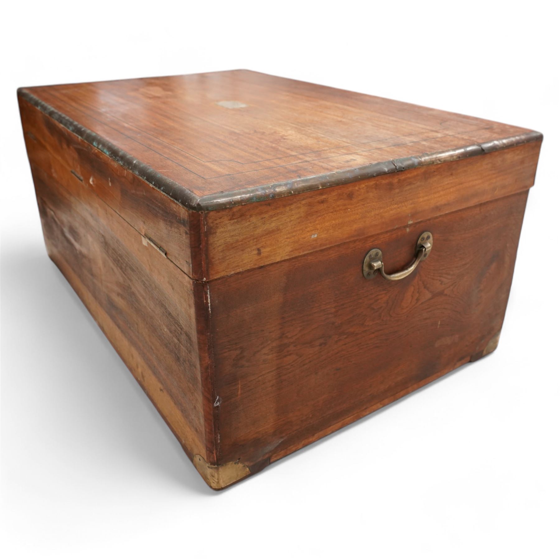 19th century camphor wood and brass mounted campaign chest, hinged lid with recessed brass handle enclosing vacant interior, mounted by brass edging and bands 