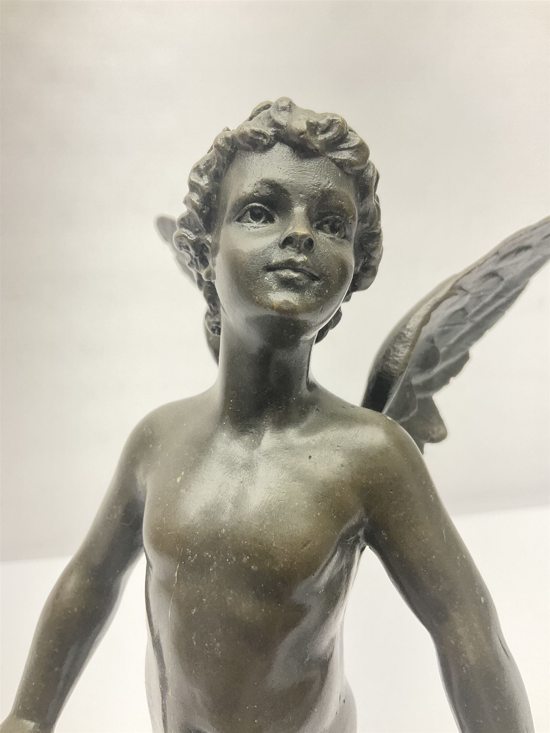 After Moreau, bronzed figure modeled as an angel holding a bow, with foundry mark upon socle base, H30cm