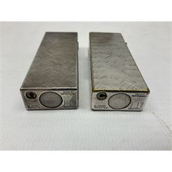 Three Dunhill silver plated lift-arm lighters, of rectangular form with engine turned decoration, marked Dunhill, two with original cases 