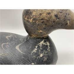 Early 20th century American carved wooden decoy duck, with weight beneath marked CJ Raymond Lead Co Chicago, Ill, H18cm, L38cm 