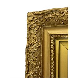 Rectangular wall mirror, in ornate gilt frame decorated with trailing leafy branches and flower heads 