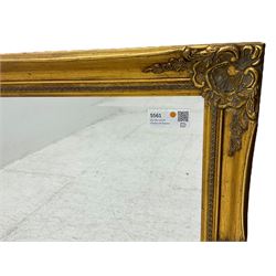 Swept gilt framed wall mirror with rectangular bevelled plate