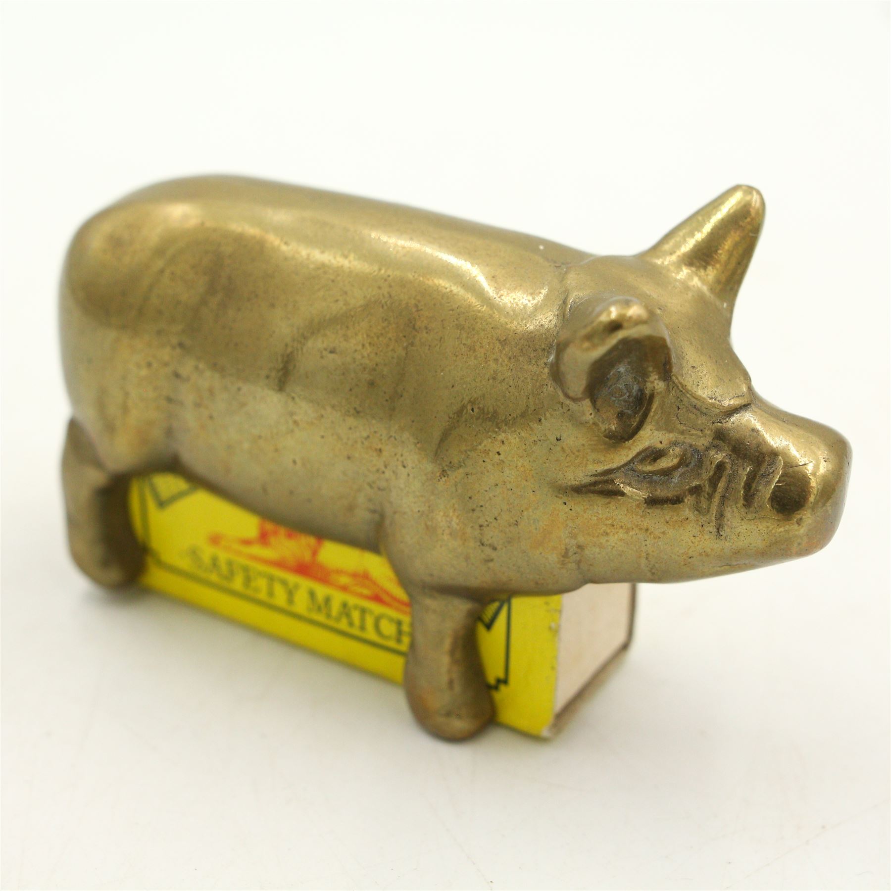 Novelty white metal vesta in the form of Punch and Judy's dog Toby, with indistinct rd. no. H5.5cm, brass matchbox holder in the form of a pig and a Victorian silver-plated horseshoe form vesta (3)