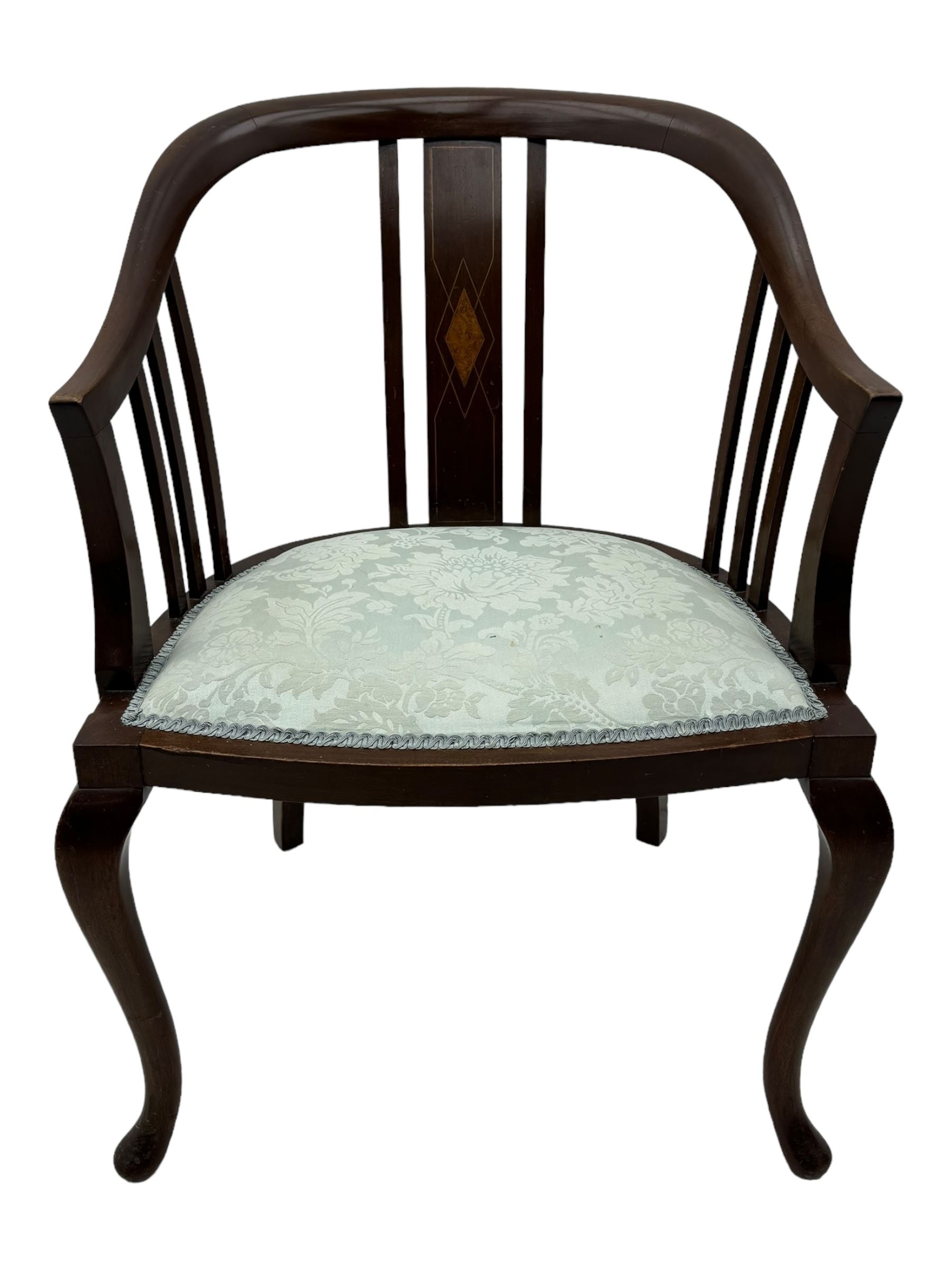 Edwardian inlaid mahogany tub-shaped armchair, curved backrest with inlaid central splat with diamond motif, over padded upholstered seat in pale blue damask fabric, on cabriole supports