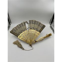 19th century carved gilt wood fan by Eugene Rimmel, the guards and sticks with pierced floral decoration, the chiffon leaf worked with sequins, with silk beaded tassel, stamped E.Rimmel 36 Strand London, with a purple silk lined box 