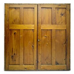 Large 19th century pine cupboard, rectangular top over two panelled later doors, enclosing four open shelves, on plinth base