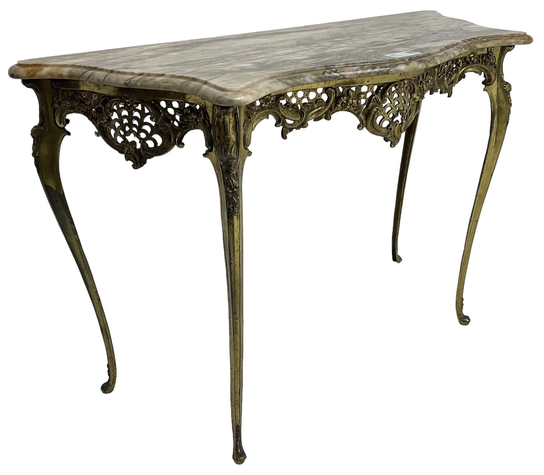 Louis XVI design serpentine front console table, shaped marble top over a cast brass base, the apron pierced and decorated with c-scrolls and foliate cartouche motifs, on cabriole supports with floral patterned knees