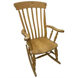 Farmhouse style beech rocking chair, shaped cresting rail on vertical slats, on turned front supports joined by swell-turned double H stretcher base