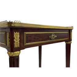 Late 19th century French figured plum pudding mahogany side table, canted rectangular white marble top with raised gilt metal gallery, fitted with a single frieze drawer, central extending floral cast ormolu escutcheon and applied moulded edging, on tapering turned and fluted supports with brass cups and castors, decorated with cast foliate mounts and foliate cast collars 