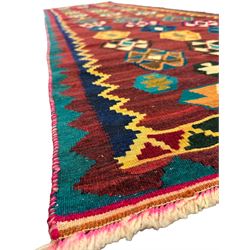 South West Persian Qashqai Kilim, crimson ground and decorated with three rows of geometric motifs, within zig-zag borders 