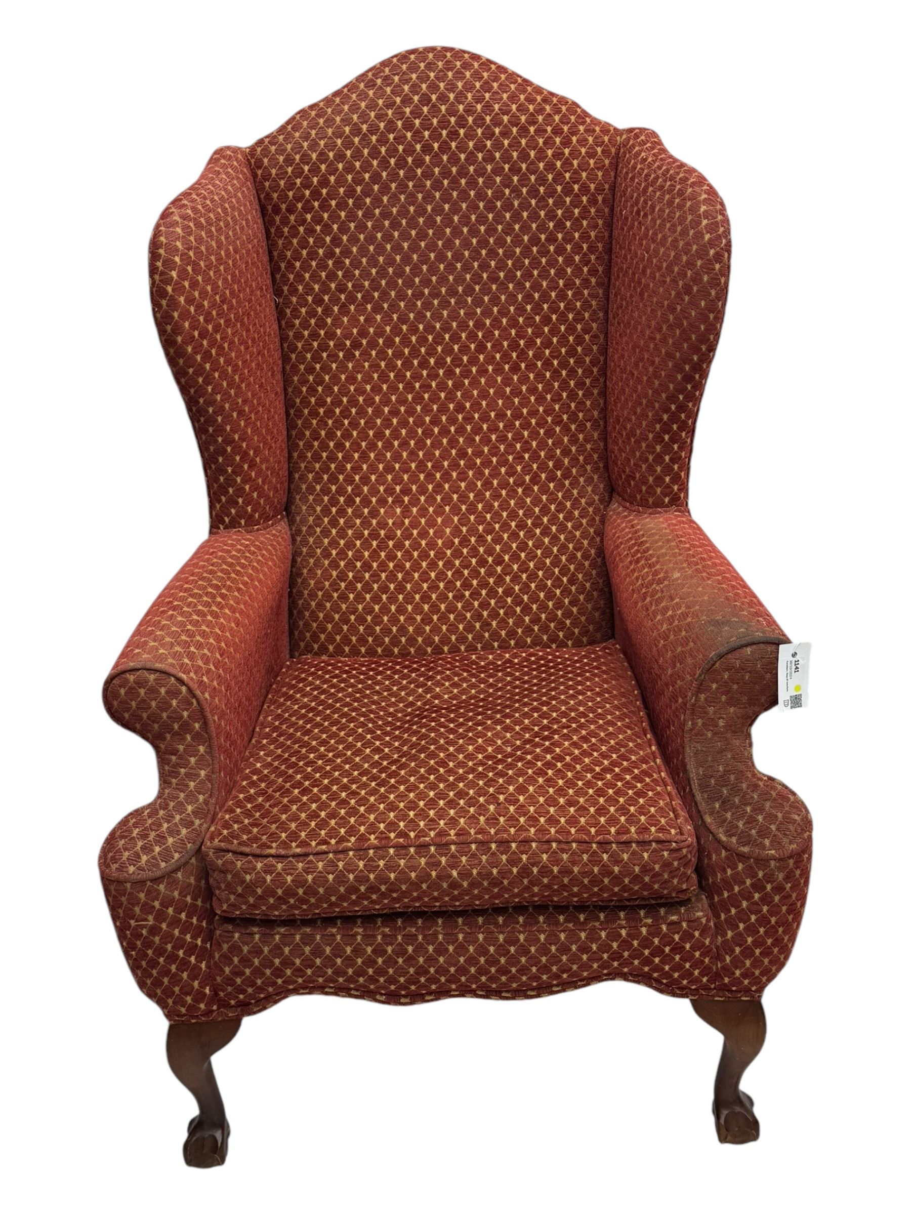 Early 20th century hardwood-framed wingback armchair, upholstered in red dotted fabric, on cabriole feet