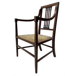 Edwardian satinwood inlaid mahogany elbow chair, the bar back over four vertical rails with foliate and scroll carved decoration, curved and down-swept arms, on square tapering supports united by stretchers 