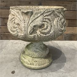 Cast stone circular garden urn decorated with scrolling foliate relief pattern