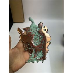 Free form copper splash, with green patina and polished copper accents, upon a silver metal stand, H20cm 