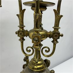 20th century five branch candelabra, with gilded floral garland and female mask decoration, to a marble effect resin urn and stepped base, upon four paw feet, H61cm