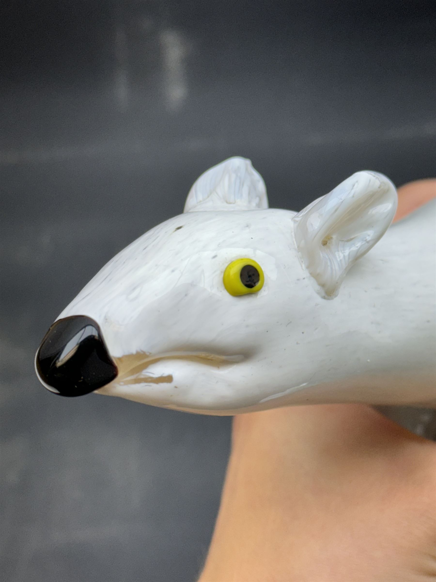 Milk glass decanter, modelled as a moon with a painted face, together with glass animals modelled as a polar bear, turtle and badger, together with other glass  