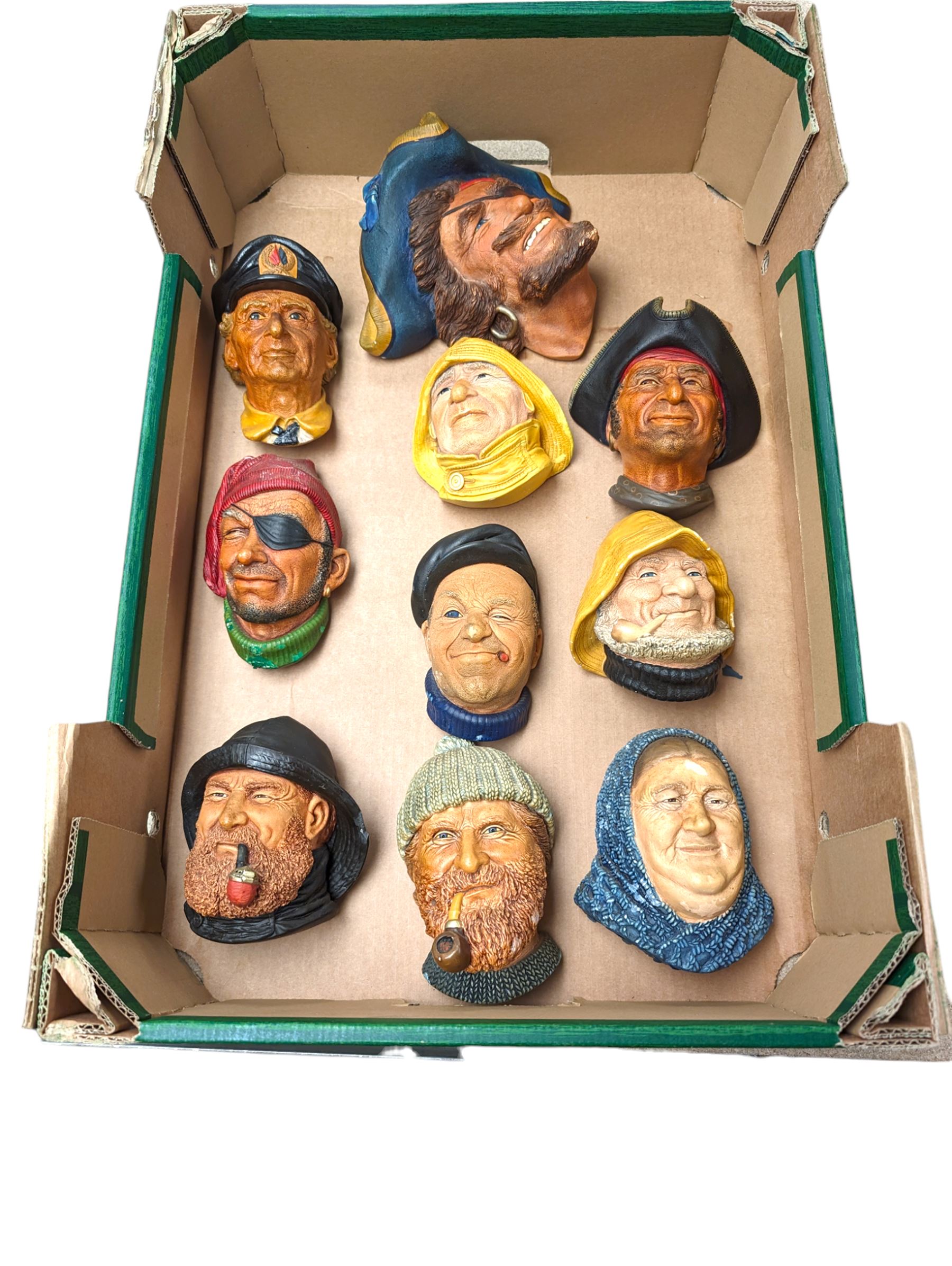 Ten Bossons Chalkware masks, all maritime themed, to include fishermen, pirates, etc 