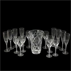 Part suit of Stuart Ariel drinking glasses comprising eight champagne flutes, six white wine glasses and two red wine glasses, together with a Saint Louis heavy cut glass vase, H25cm