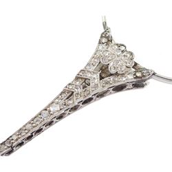 Early 20th century platinum and diamond lorgnette, the milgrain set rose cut diamond handle, with flower head terminals, the reverse with engraved foliate decoration, to spring-loaded glass lenses