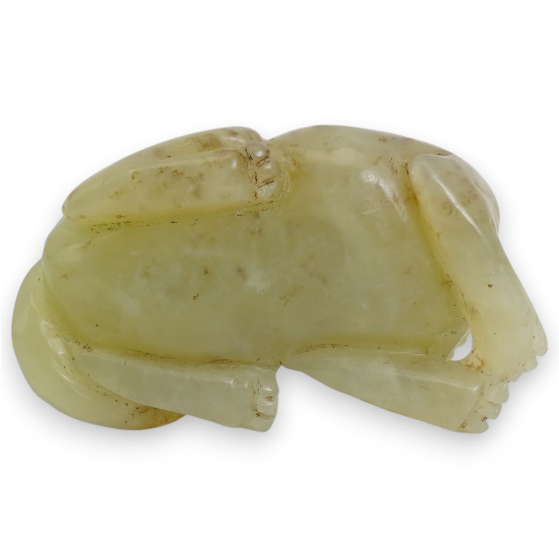 Small Chinese carved jade model of a tiger, modelled in a crouching position, 4.3cm long