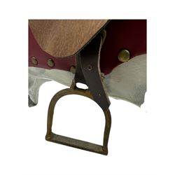 Mid 20th century rocking horse, dappled grey painted horse with applied mane and tail, red leather saddle and bridle accented with brass studs, supported by a stained wooden frame with turned supports and iron brackets, mounted on rockers