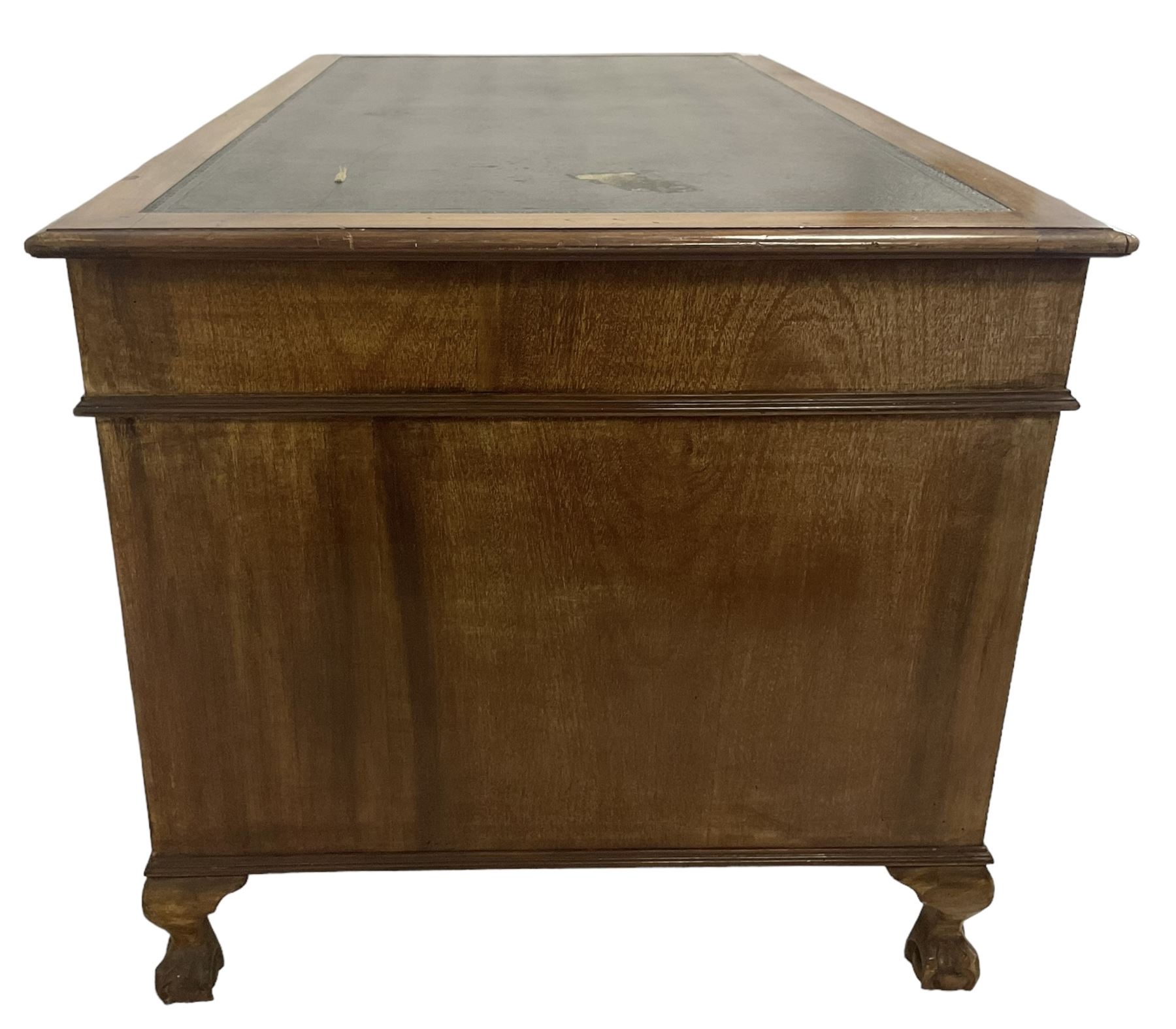 Georgian design twin pedestal desk, rectangular top with green leather inset, fitted with nine drawers, on cabriole supports with ball and claw feet 