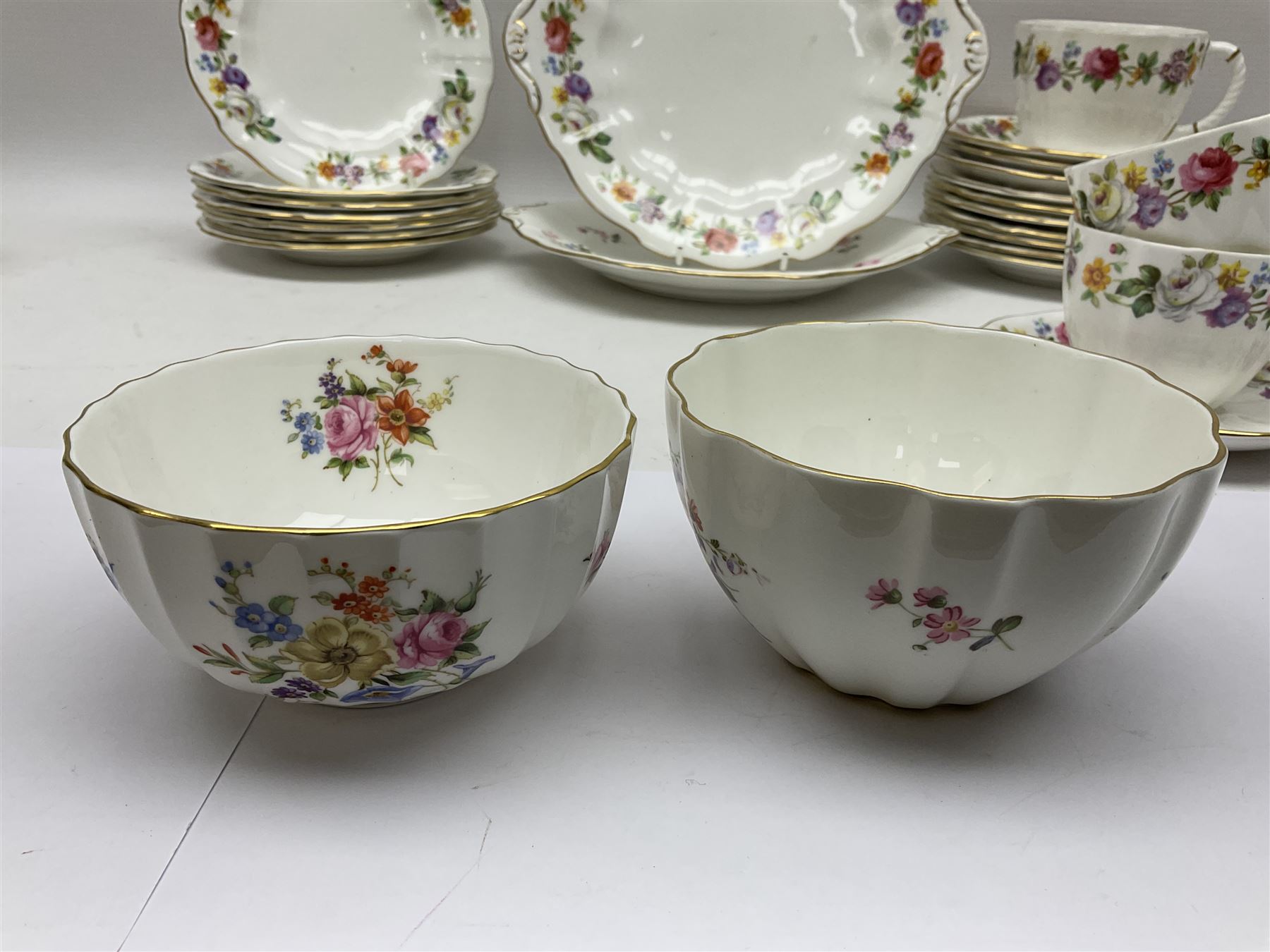 Royal Crown Derby Posies pattern tea service, including two milk jugs, two open sucrier, twelve teacups and saucers, twelve dessert plates etc 