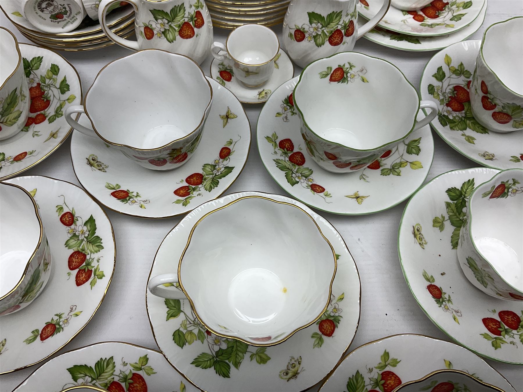 Ringtons and Queen's China Virginia Strawberry pattern teawares, including teacups, saucers, milk jugs, sugar bowls, etc