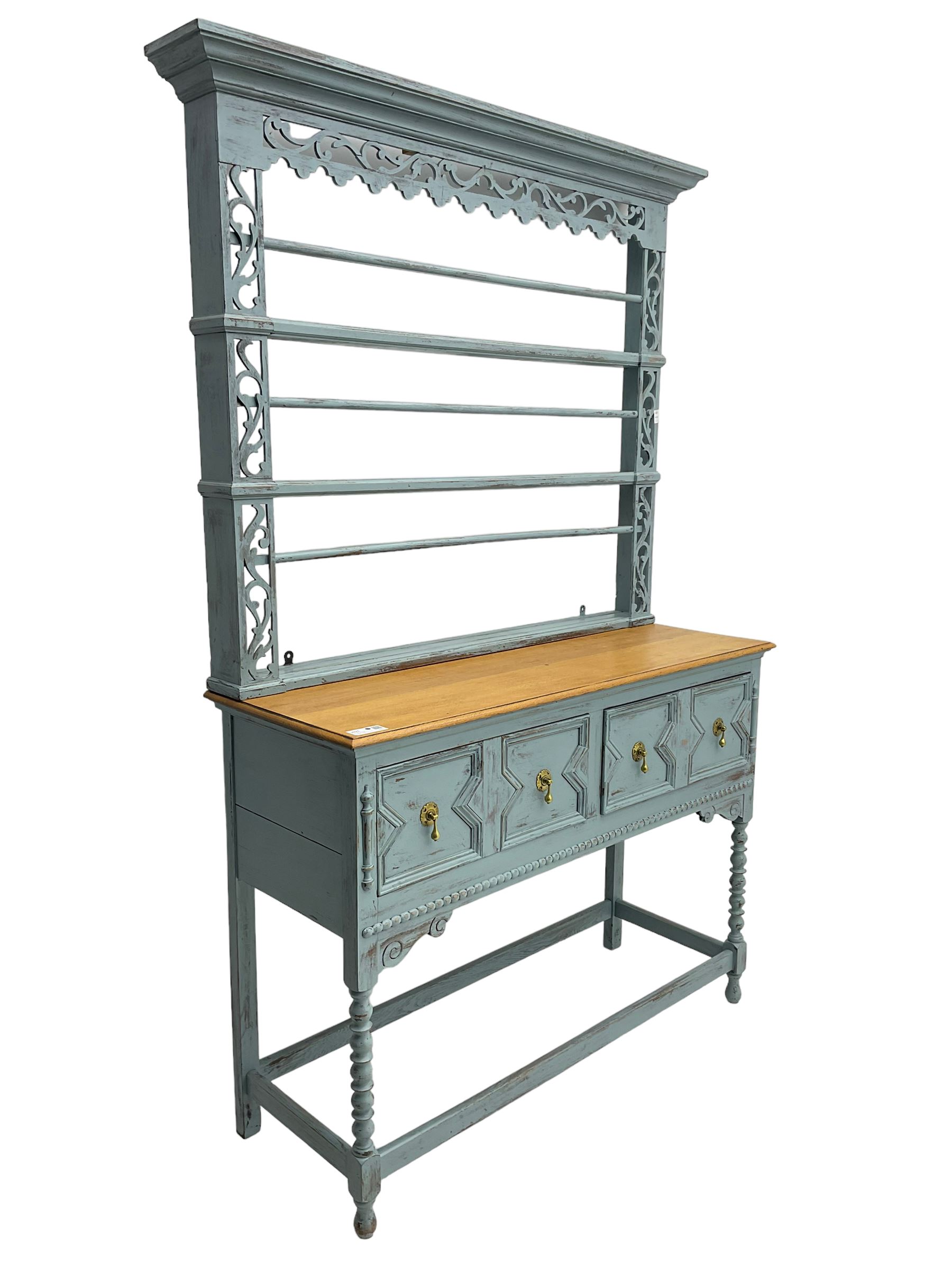 20th century painted oak dresser, projecting moulding cornice over pierced frieze and upright, moulded rectangular top over two drawers with geometric mouldings, on turned supports united by stretchers 