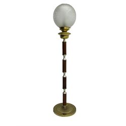 Victorian brass and wood standard lamp, frosted glass globe shade with etched floral design, brass collar above reeded wooden column with metal spacers, on circular brass base with fluted decoration