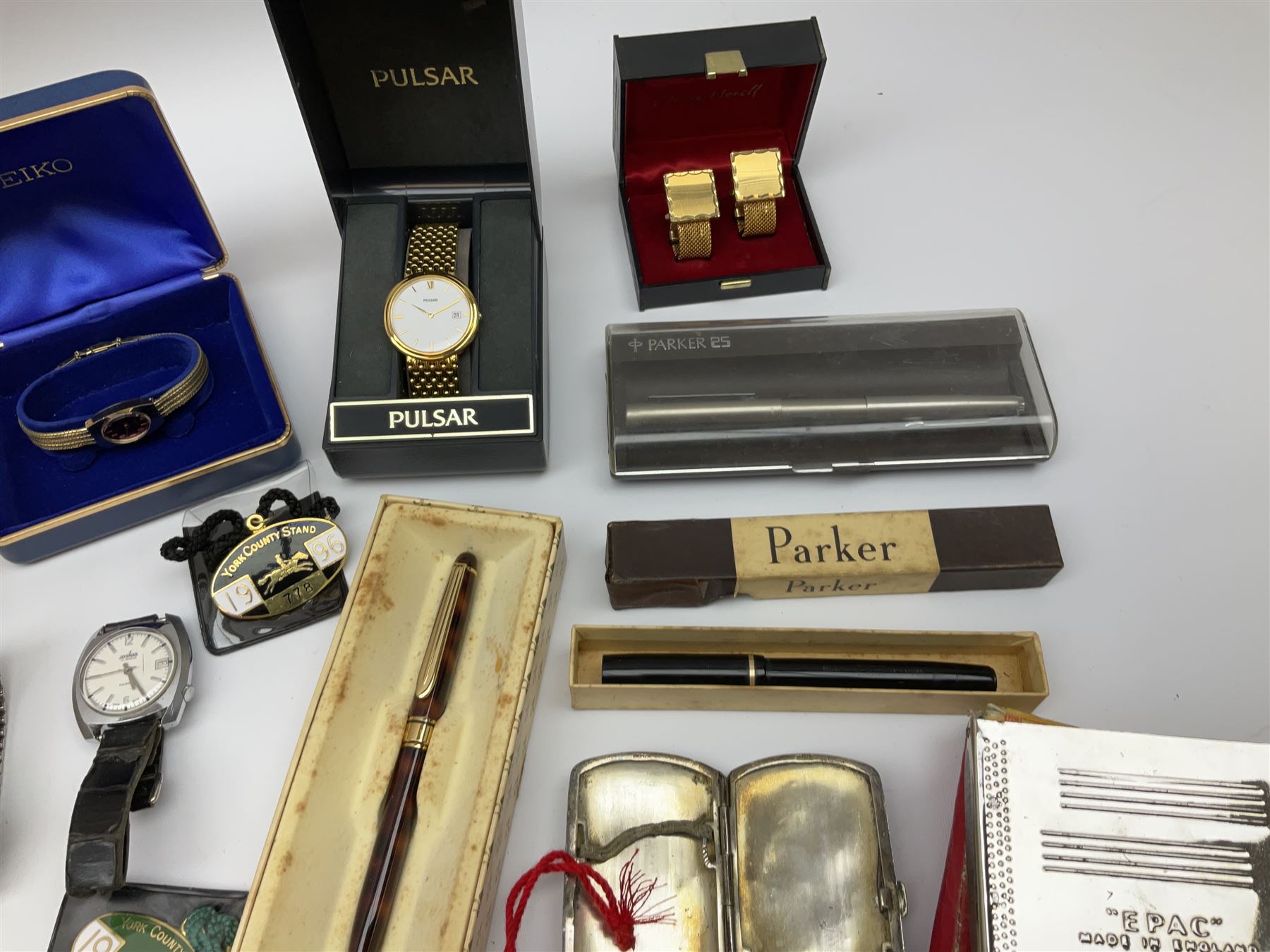 Collection of watches, including Pulsar, Seiko, Cartier, together with Henry Morell cufflinks, cigarette cases, and a group of Parker pens. 