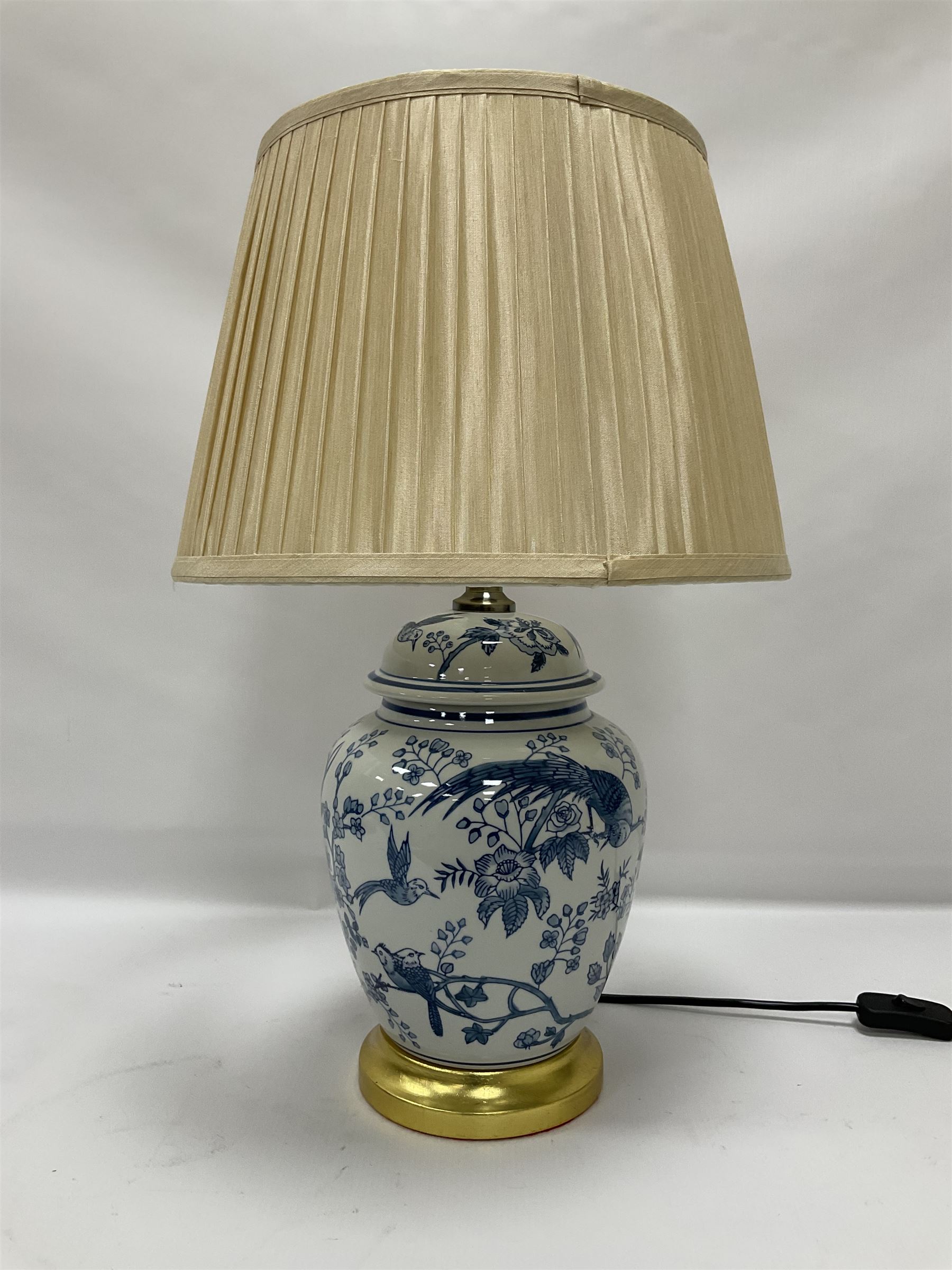 Table lamp of baluster form, decorated with exotic birds up fruiting trees, on gilt chrome pedestal, including shade H554cm