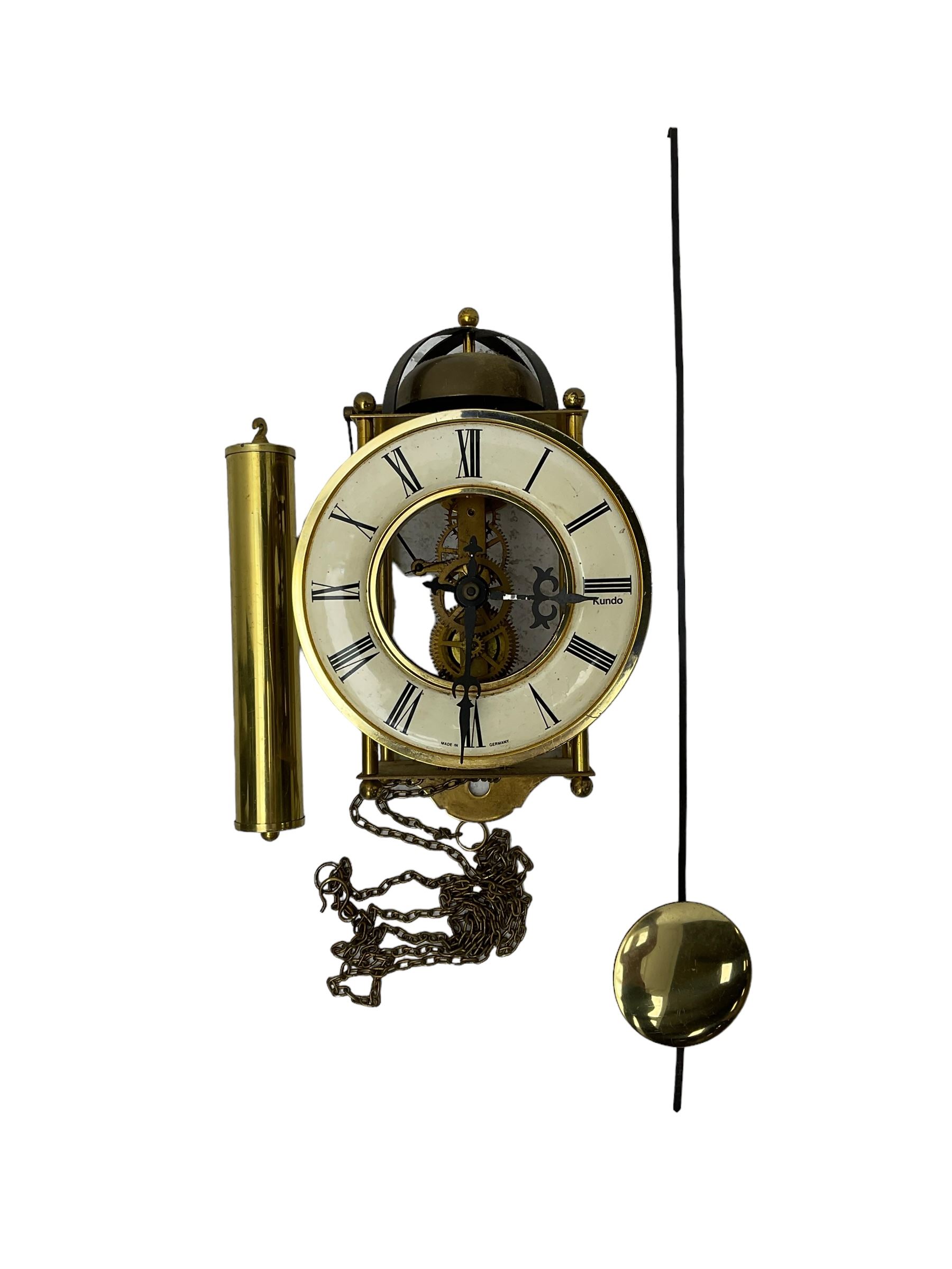 A 20th century cuckoo clock and weight driven German wall clock.