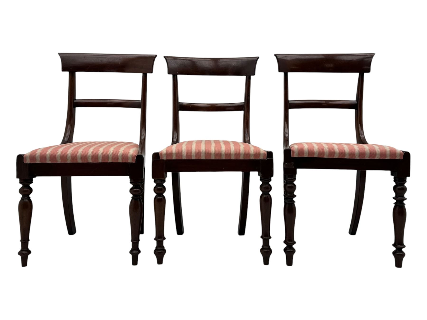 Set of six Victorian mahogany dining chairs, curved bar back over drop-in seat upholstered in striped fabric, on turned front supports