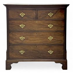 George III mahogany chest of drawers, moulded rectangular top over two short and three lon...