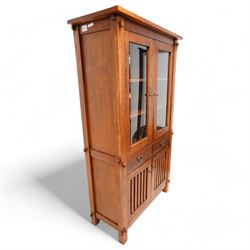 20th century reclaimed hardwood bookcase display cabinet, fitted with two glazed doors above two drawers, two slatted cupboards to base