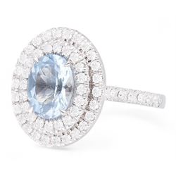 18ct white gold oval cut aquamarine and round brilliant cut diamond, double halo cluster ring, hallmarked, aquamarine approx 1.60 carat, total diamond weight approx 0.75 carat