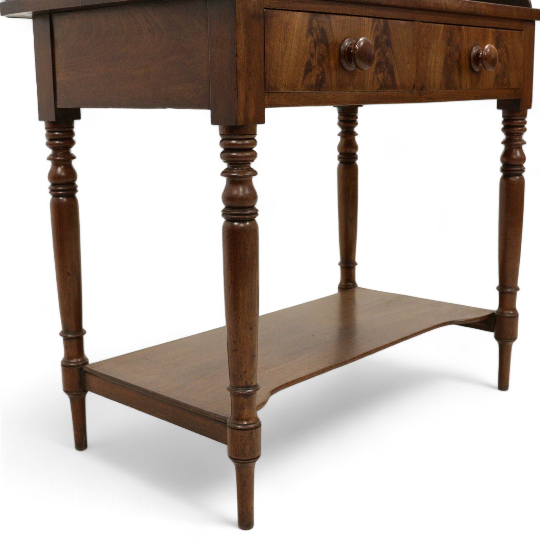 Early Victorian mahogany wash stand, pointed and sloped arch back with shaped and pierced scroll returns, rectangular top over two drawers, on turned supports united by undertier 