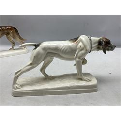 Two Hertwig and Co Katzhutte figures of dogs, comprising a German Shepherd and a pointer dog, both with printed marks beneath, largest H21.5cm W25cm