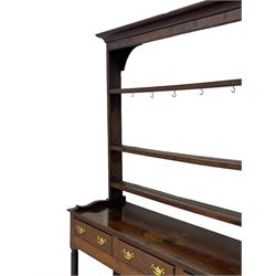 18th century oak dresser, raised three tier plate rack with moulded cresting rail, rectangular top over three drawers, the drawer fronts with moulded edges, turned supports united by pot board base 