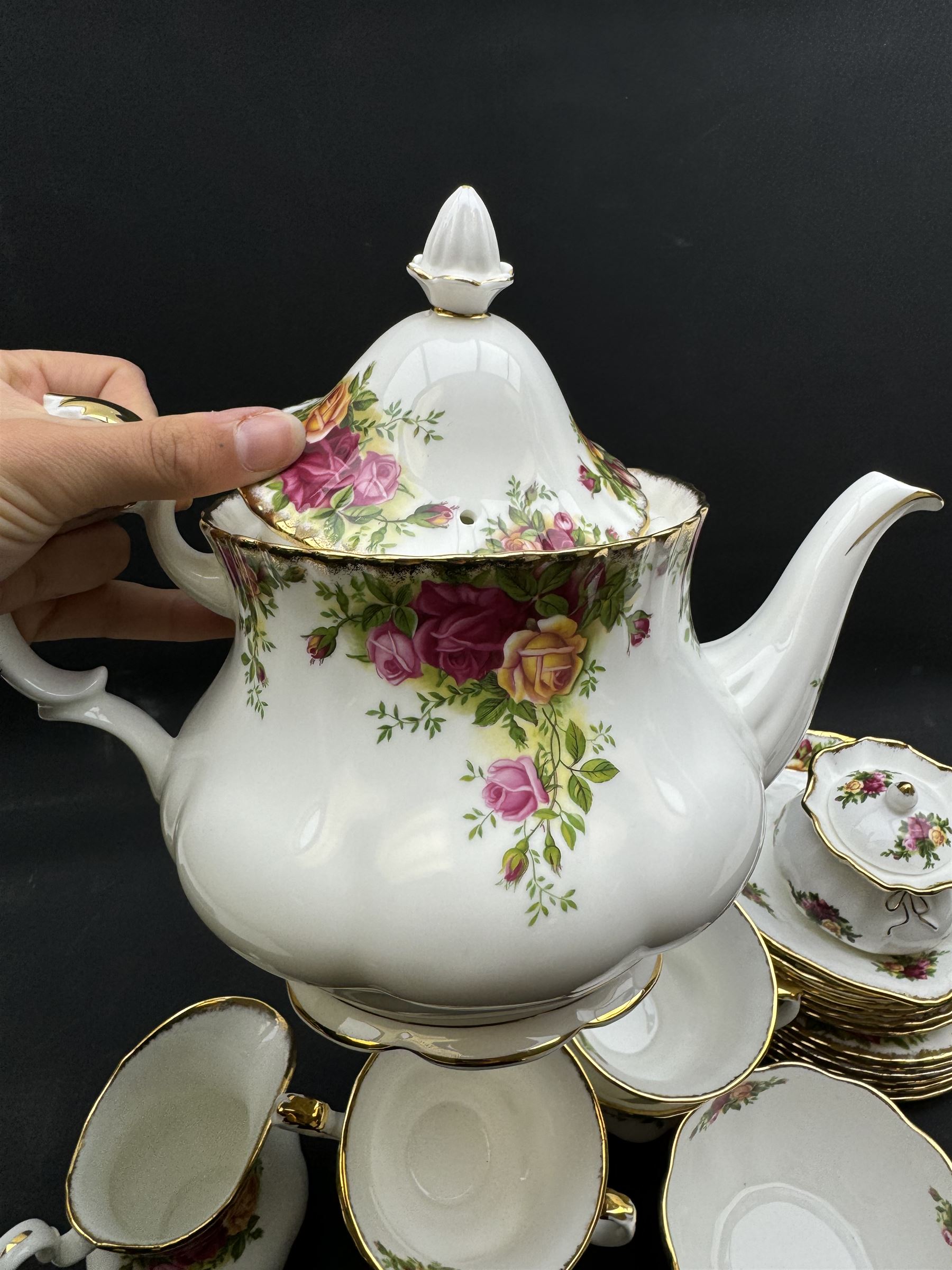 Royal Albert Old Country Roses tea service for six, comprising teapot, milk jug, open sucrier, cups and saucers, dessert plates, two trinket dishes covered jar and clock